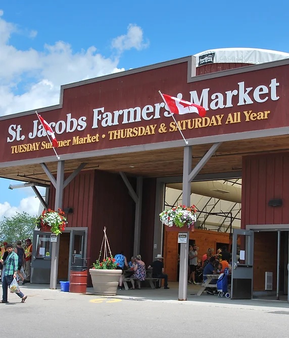 sign for St. Jacob's Farmers market outside the entrance on a sunny day.